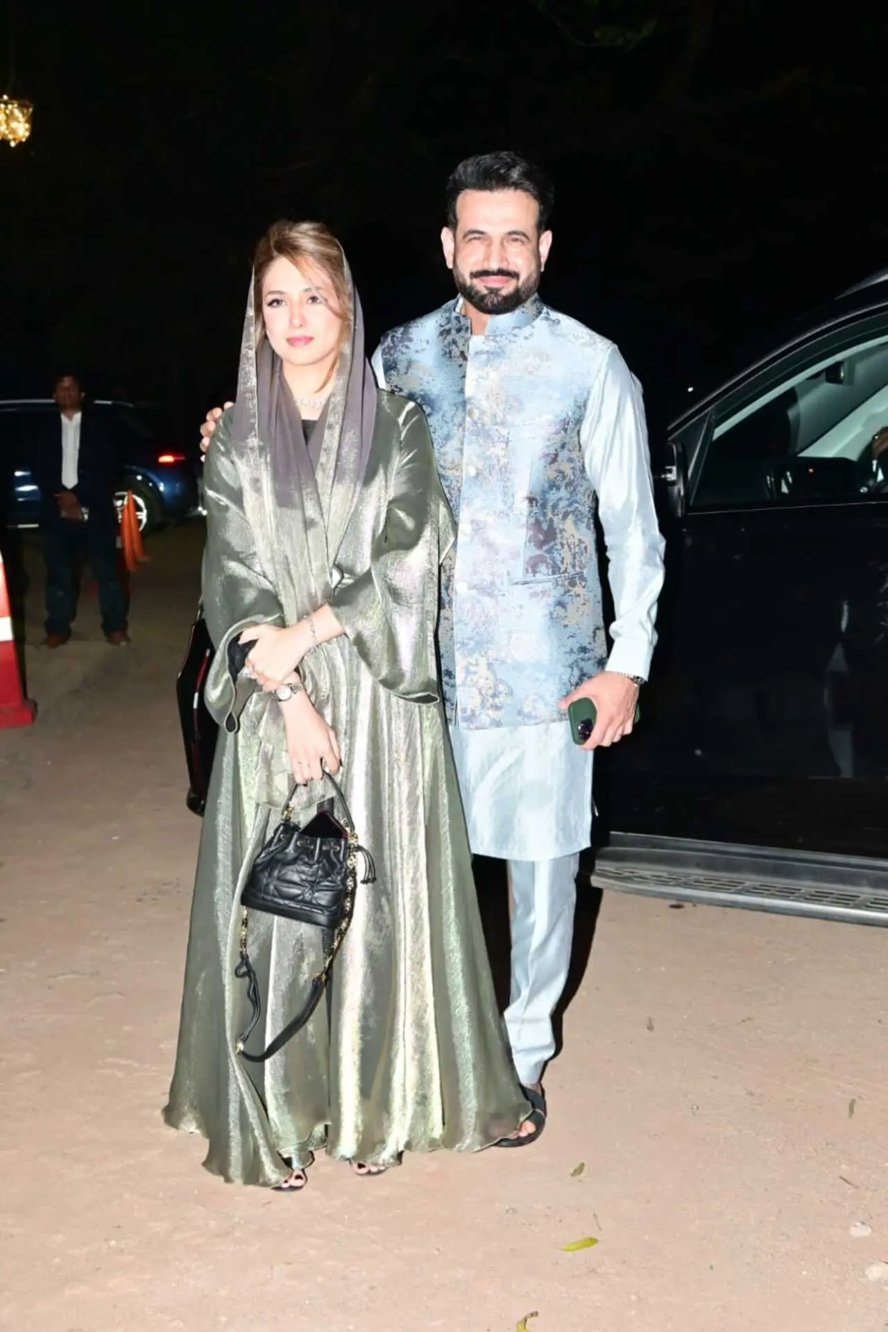 Irfan Pathan posed with his wife Safa Baig at a festive evening event, exuding elegance. He looked sharp in a powder blue kurta set.